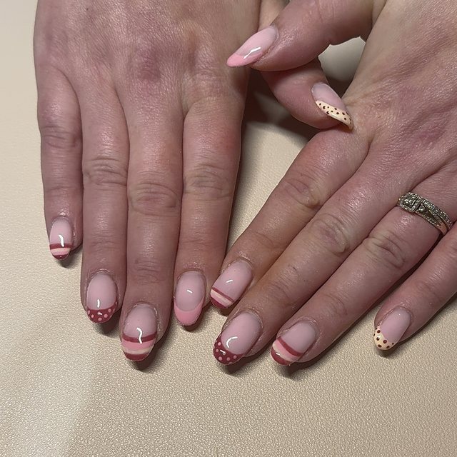 Pink and burgundy French tips with dots and stripes