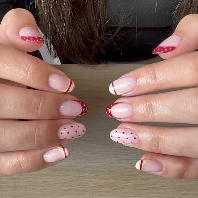 Red dotted and striped French tips in cream and red